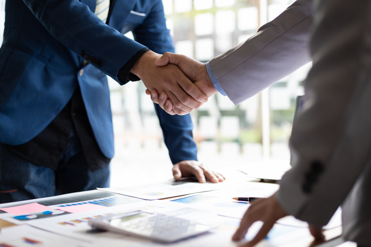 Business professionals shaking hands.